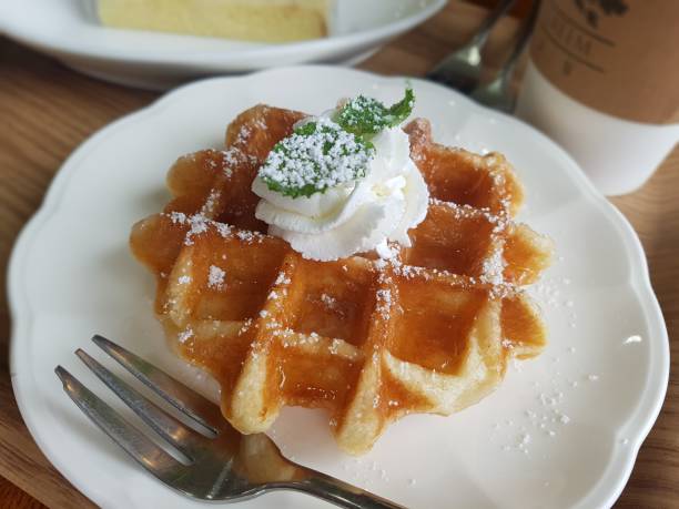 istock Belgian waffles very delicious desserts 1214444081