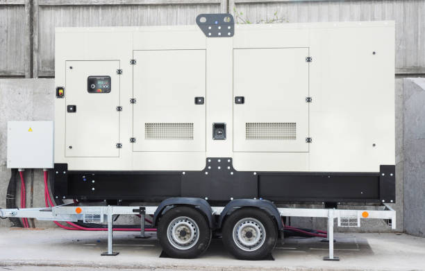 istock Backup Generator on the trailer wheels connected to the control panel with a cable wire. Power backup generator. 1214447852