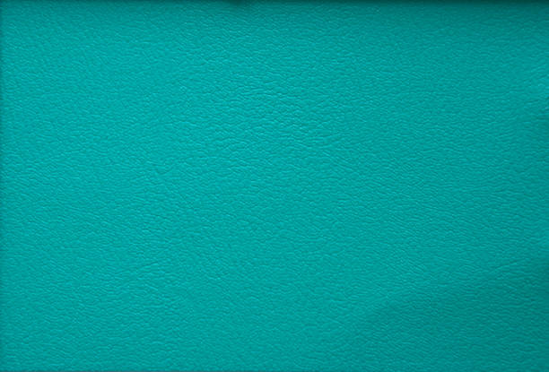 A fragment of genuine leather of high-quality workmanship, artificially dyed indigo. Close-up.