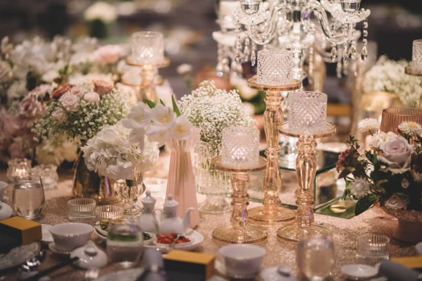 istock luxury fine dining table decoration with gold theme candle, table clothe 1214448110