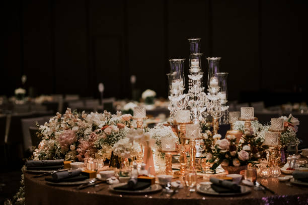 istock luxury fine dining table decoration with gold theme candle, table clothe 1214448111