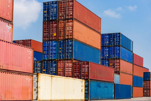 istock Stacked containers in the container terminals, Industry and Transportation concept 1214448321