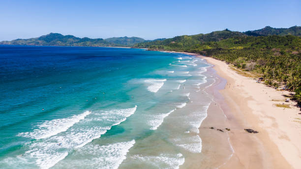 istock Surfing in Duli beach, El Nido, Palawan 1214450846