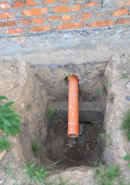 istock Close up on house septic drainage pipe in home foundation. Drain system. 1214452564