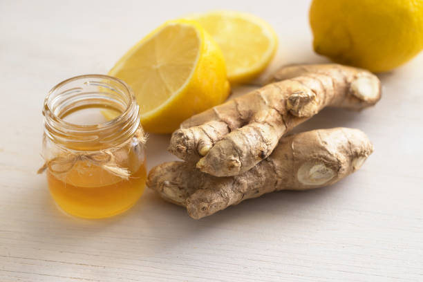 istock Ginger root, honey and lemon, ingredients for making Ginger revitalizing beverage used to help relieve cold and flu symptoms. 1214453317