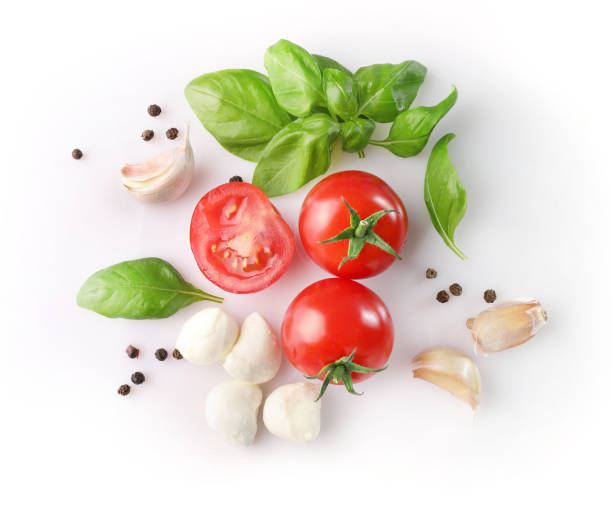 istock Cherry tomatoes, mozzarella, basil leaves and garlic cloves 1214453613