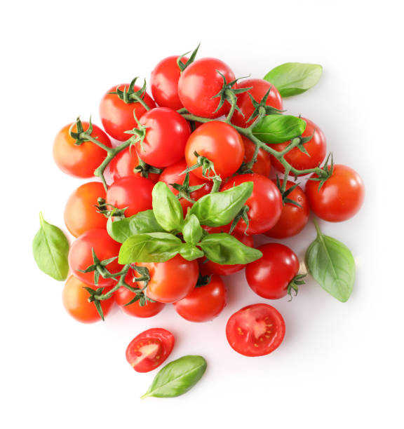istock Group of ripe red cherry tomatoes and basil leaves 1214453637