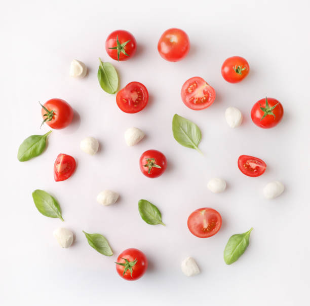 istock Composition of ripe cherry tomatoes, mozzarella and basil leaves 1214453672