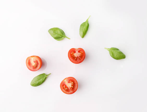 istock Fresh ripe red tomatoes and basil leaves 1214453760