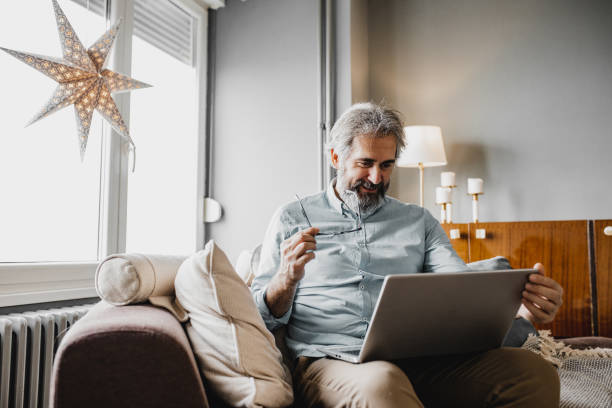 istock Mature man is working from home 1214453808