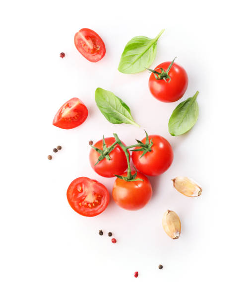 istock Red ripe cherry tomatoes and basil leaves 1214453827