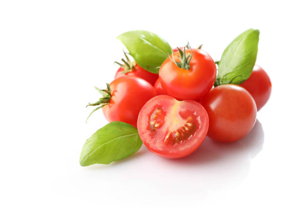 istock Red ripe cherry tomatoes and basil leaves 1214453828