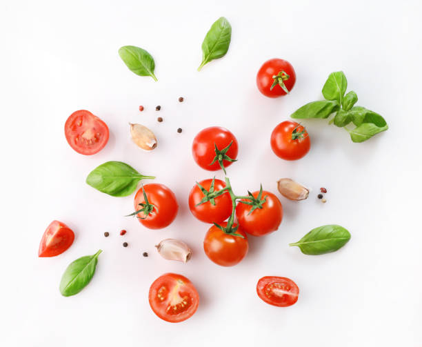 istock Red ripe cherry tomatoes and basil leaves 1214453842