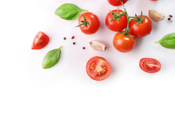 istock Red ripe cherry tomatoes and basil leaves 1214453845