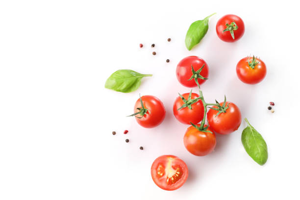 istock Red ripe cherry tomatoes and basil leaves 1214453852
