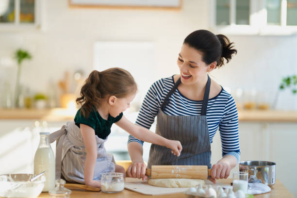 istock family are preparing bakery together 1214453994
