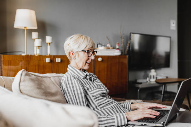 istock Mature woman is working from home 1214453999