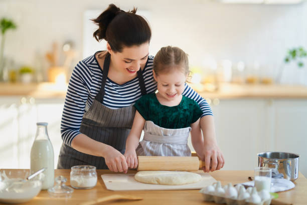 istock family are preparing bakery together 1214454014