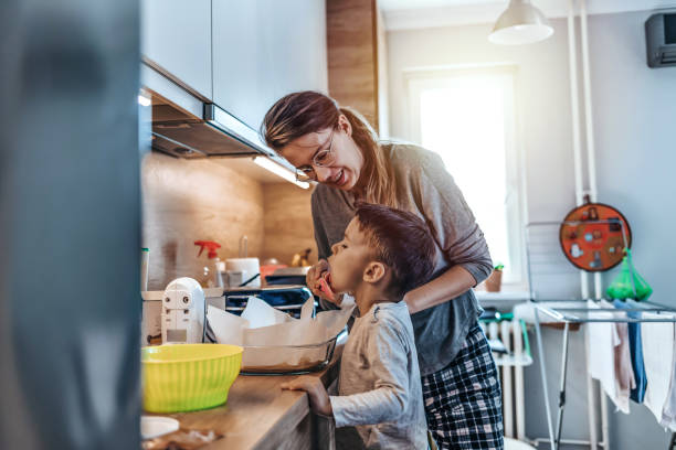 istock Mother and son baking together 1214454904