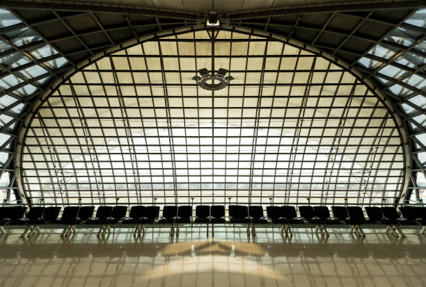 istock Clean airport waiting area interior with seats and windows. 1214455198