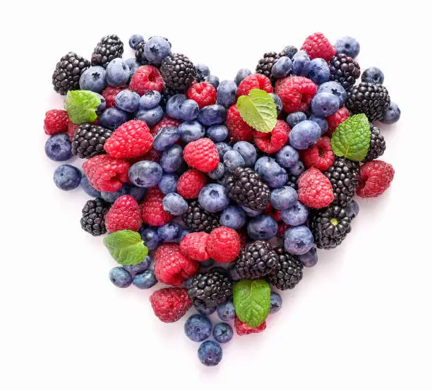 Fresh summer berries in shape of heart