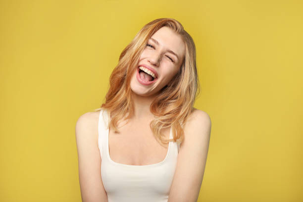 istock Making faces young woman portrait 1214456702