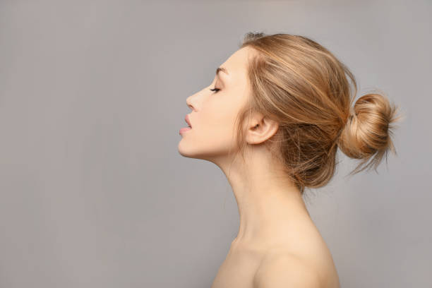 istock Beauty female portrait in profile 1214456848