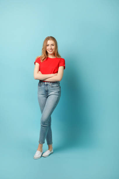 istock Smiling young woman full length portrait 1214457078