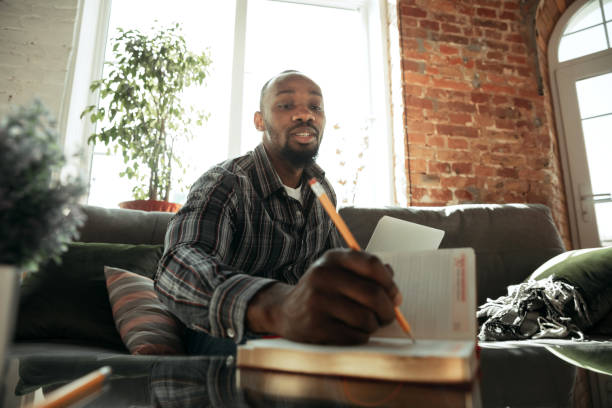 istock African-american man, freelancer during the work in home office while quarantine 1214463073