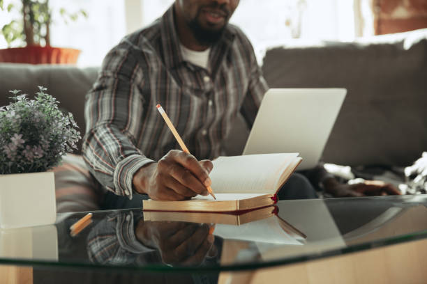 istock African-american man, freelancer during the work in home office while quarantine 1214463085
