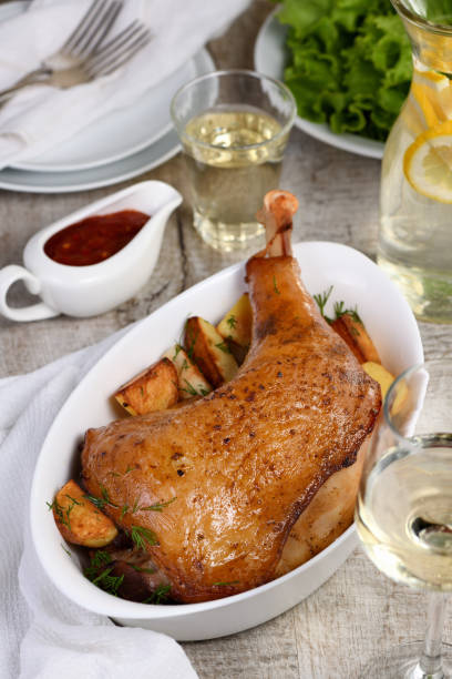 istock Roasted turkey leg with potatoes on the dinner table 1214463202