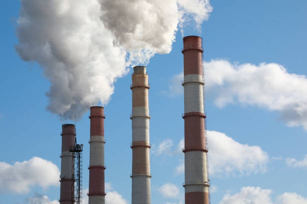 istock Chimney producing huge amount of gas pollution 1214463607