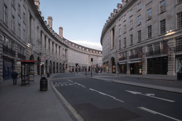 Regent Street - Central London lockdown due to the epidemic London, UK - March 21, 2020: Usually crowded Regent Street shopping during the corona virus epidemic of 2020 singh stock pictures, royalty-free photos & images