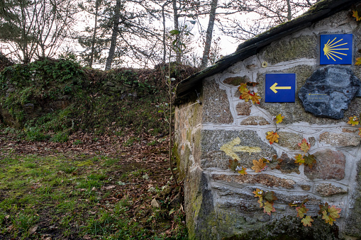Camino de Santiago Norte a sign on a house wall marks the route to follow Guitiriz, Galicia Spain