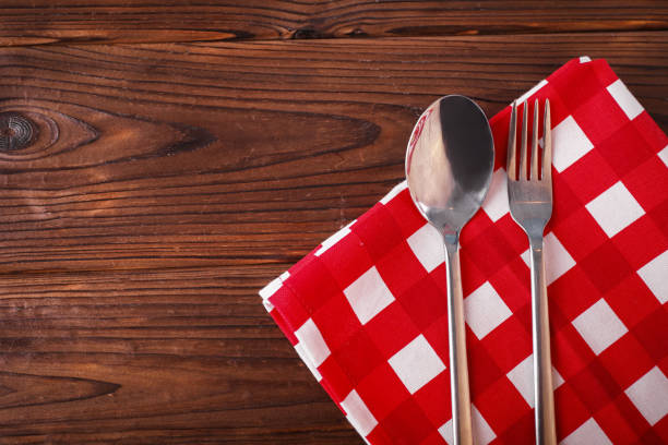 Red napkin on wooden table
