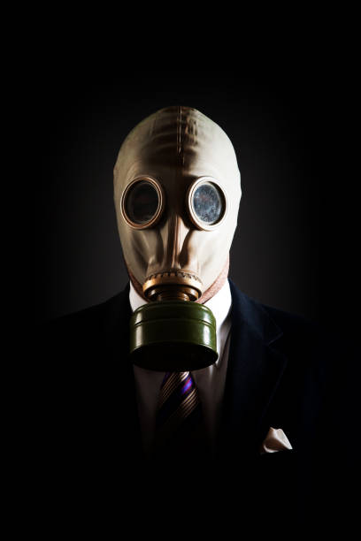 istock Young white collar wearing a protective gas mask 1214470277