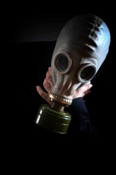 istock Young white collar wearing a protective gas mask 1214470343