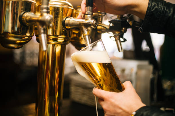 Pouring Beer Pouring Beer keg stock pictures, royalty-free photos & images