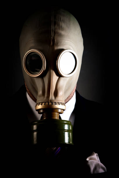 istock Young white collar wearing a protective gas mask 1214471290