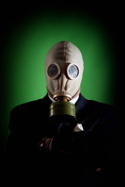 istock Young white collar wearing a protective gas mask 1214471291
