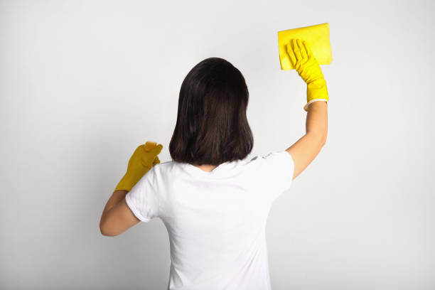 istock Wiping with cleaning rag woman 1214471292