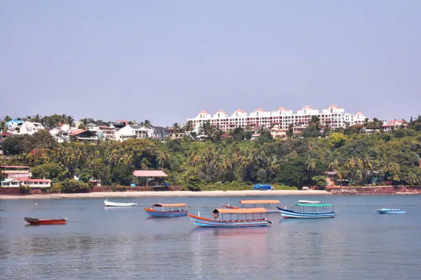 Photo of boats anchored in the middle of the ocean in Dona paula, Goa