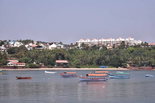 Photo of boats anchored in the middle of the ocean in Dona paula, Goa