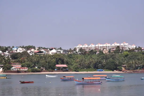 Photo of boats anchored in the middle of the ocean in Dona paula, Goa
