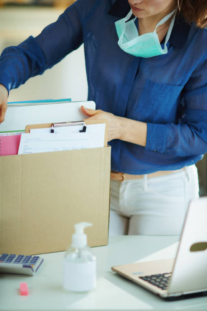 istock modern woman transporting work stuff to home office 1214473208