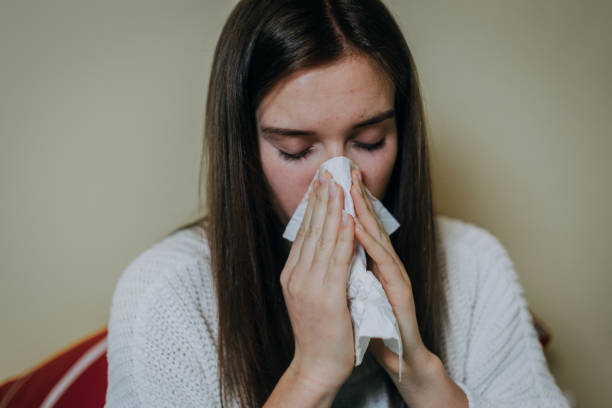 istock Woman sick in bed, covered with blanket 1214473717