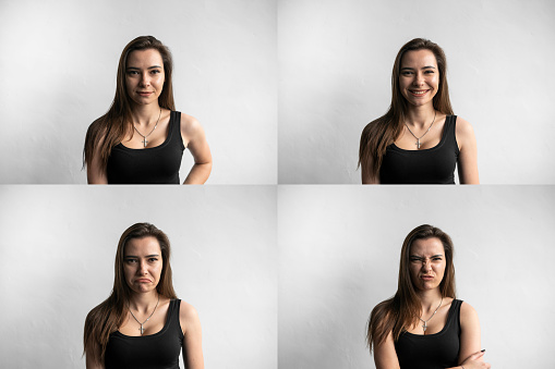 Set of young woman's portraits with different emotions. Young beautiful cute girl showing different emotions. Laughing, smiling, anger, suspicion, fear, surprise