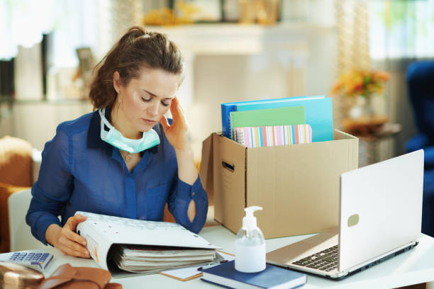 istock stressed female with mask working in modern house in sunny day 1214474325