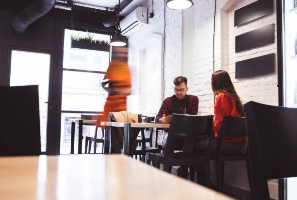istock Waiter Takes Order From a young Couple 1214475125