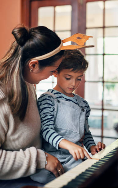 istock Playing Christmas carols with her cutie 1214475374